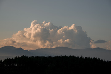morning sky with large white clouds. Beautiful view of cloudscape and mountains