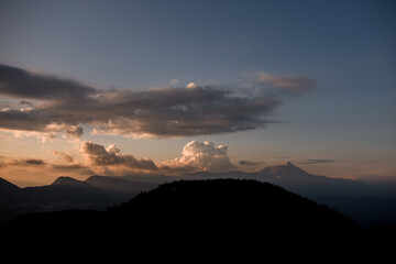 Great view of sky with big clouds over mountain landscape. Beauty in nature.