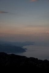 enchanting aerial view of sea bay and mountains in mist from high point of drone fly
