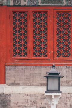 Lamp with red wall and spring flowers in the Forbidden City, Beijing, China