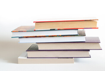 A stack of old books on a white background.