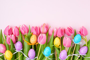 spring flat lay with tulips on pink