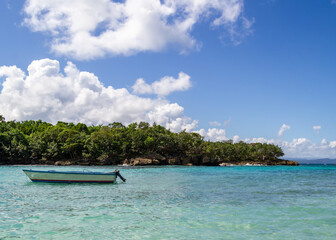 Fototapeta na wymiar boat on the beach Dominican Republic