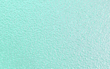 Mint green foil paper texture background.