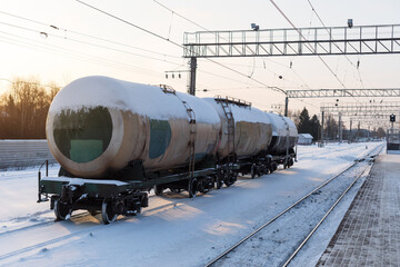 railway tank cars in winter. Tanks with fuel being transported by rail