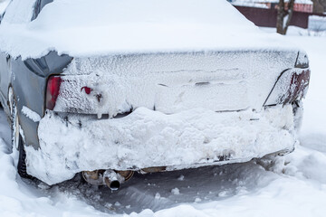 Parking of cars covered with snow. Heavy snowfall covered the road. Car in the snow