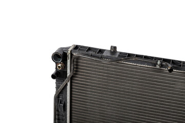 Fototapeta premium The old cooling radiator is a metal heat exchanger inside filled with antifreeze. Repair in the workshop. Parts Catalog.