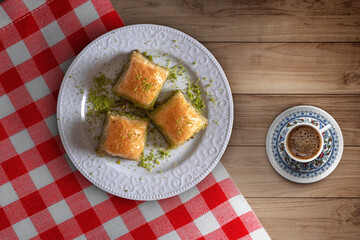 Turkish coffee and baklava. Sweets and coffee standing on the wooden table