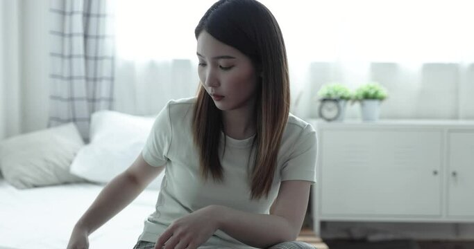 Asian woman are stressed, She doesn't want to answer the phone and wants to be alone.