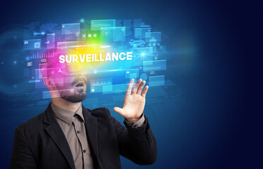 Businessman looking through Virtual Reality glasses