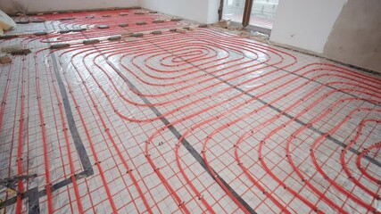 Installing underfloor heating pipes for water heating. Heating systems. Pipes for a heat-insulated floor.