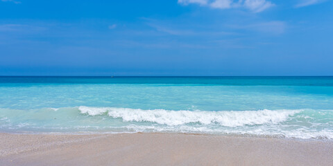 Panorama of turquoise sea, blue sky and sandy beach