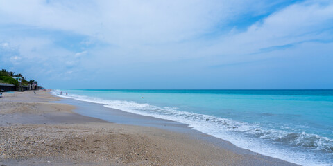 Panorama of the beach on the Atlantic coast. Blue sky and turquoise sea