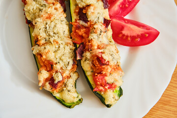 Stuffed zucchini on white plate