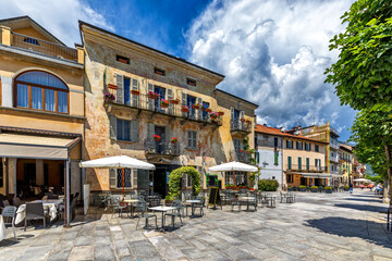 Old houses and outdoor restaurant in Cannobio, Italy.
