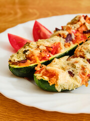 Stuffed zucchini on white plate