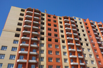 Construction of a new multi-storey brick house.