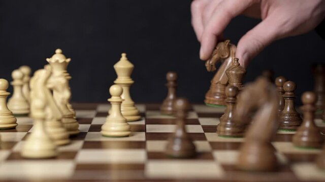 The chess game is played for a long time. The player makes a knight move to change the chess game. Chess is about training thinking and making quick decisions. playing chess is very popular