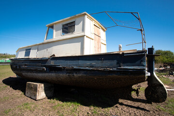 Old fashioned obsolete boat in a salvage yard © simonXT2