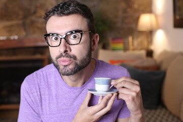 Funny man gossiping during tea time