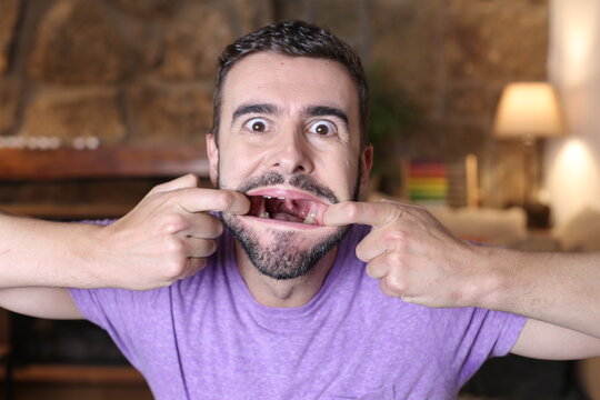 Funny man showing his uvula