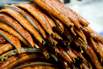 Smoked eel fillet on the kitchen table. Close-up.