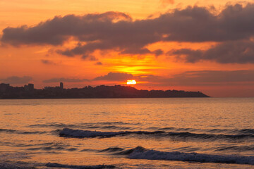 Fototapeta premium The sun rising at dawn from Alicante Beach. Spain 