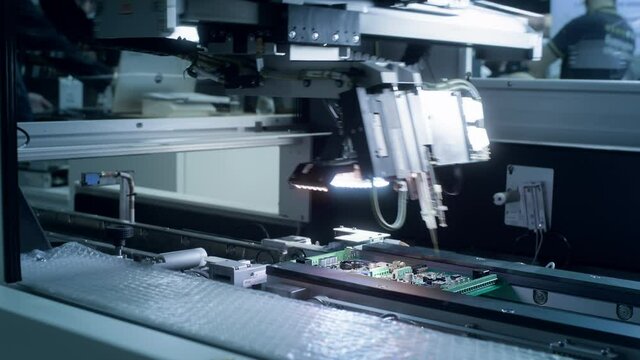 Printed circuit board without electronic components ready for assembly. Technological process. Needle automatic equipment diagnose and test chips and processors. Installation of SMD components