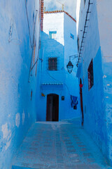 Empty narrow street in the Medina quarter in Chefchaouen or Blue city in Morocco, North Africa