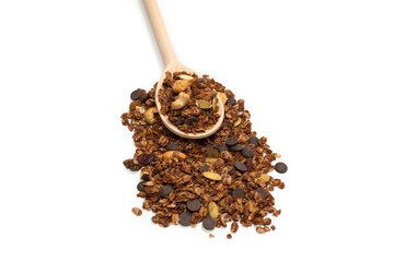 Chocolate granola cereal with nuts in a wooden spoon.