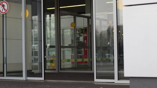 slow motion of closing automatic glass doors at the airport terminal 