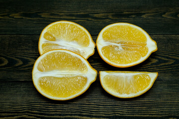 Ripe source lemons  on a wooden background  photographed from above