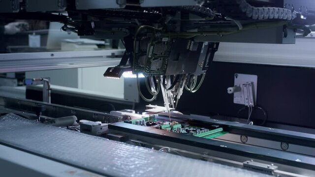 Printed circuit board without electronic components ready for assembly. Technological process. Needle automatic equipment diagnose and test chips and processors. Installation of SMD components