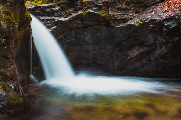 Small waterfall in the mountains in long exposure