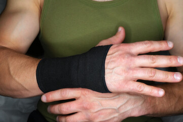 black sports wrist bandage for arm fixation