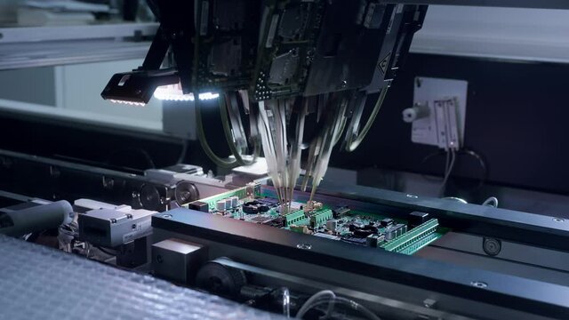 Printed circuit board without electronic components ready for assembly. Technological process. Needle automatic equipment diagnose and test chips and processors. Installation of SMD components