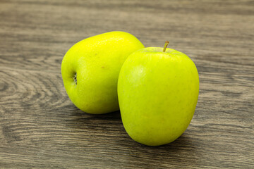 Two ripe green sweet apples