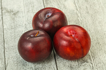 Ripe sweet plum fruit heap