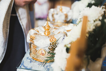 Obraz premium Golden crowns lying on the table in church
