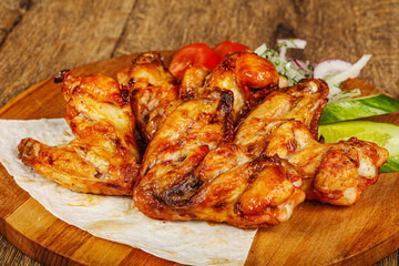 Chicken wings barbeque vith vegetables