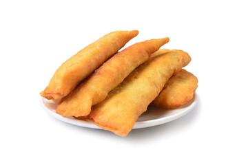 freshly baked pasties on a white plate isolated on a white background.