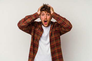 Young caucasian man isolated on white background screaming, very excited, passionate, satisfied with something.