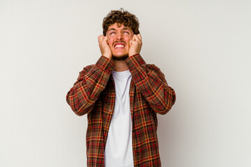 Young caucasian man isolated on white background crying, unhappy with something, agony and confusion concept.