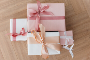 several pink gift boxes with ribbon bows. The concept of gifts and holidays.
