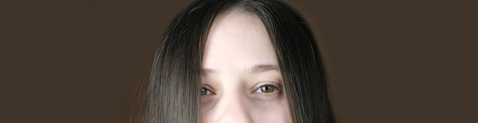 Naklejka premium young woman, part of the face, funny eyes close up, looking directly, the concept of diagnosis, treatment of ophthalmic diseases, eyelids, emotional, psychological state, banner
