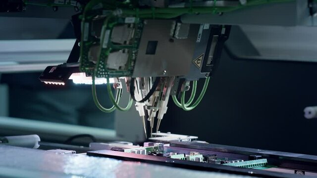 PCB Tiles Manufacturing. Automated Circut Board machine Produces Printed digital electronic board. Automatic assembly of smd components, 4 industrial revolution. Manufacture of electronic chips