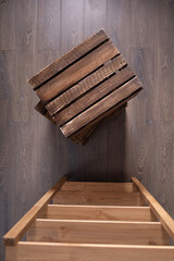 Fototapeta na wymiar Stack of wooden box on floor laminate background. Wood boxes crate