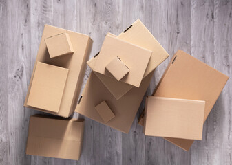 Stack of cardboard box on floor laminate background. Cardboard boxes for moving to new home