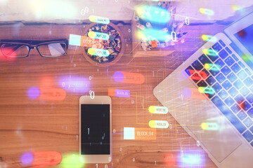 Double exposure of technology theme drawing over work table desktop. Top view. Global data analysis concept.