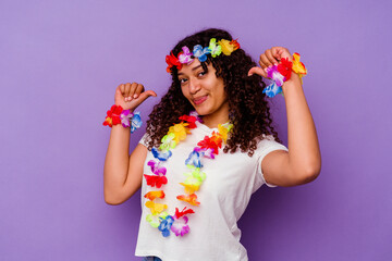 Young Hawaiian woman isolated on purple background feels proud and self confident, example to follow.